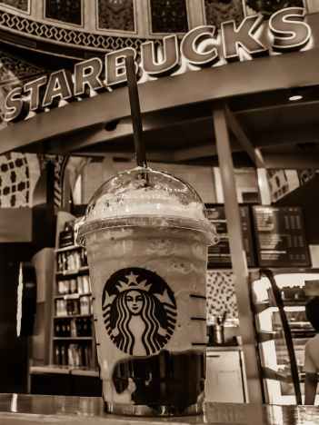 starbucks stall grayscale photo
