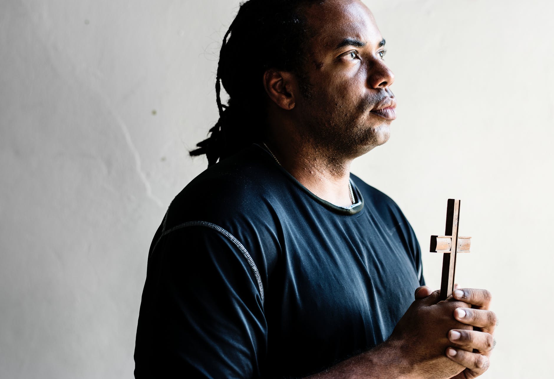 man holding cross
