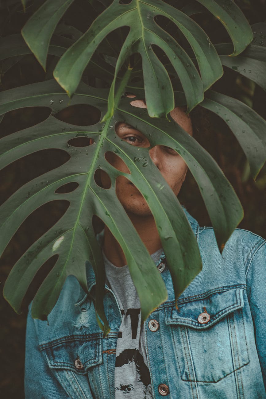 man wearing blue denim jacket
