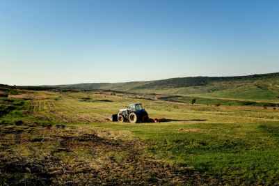 photo of tractor on fields