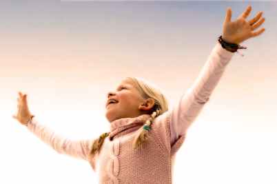 blonde haired girl wearing pink sweater