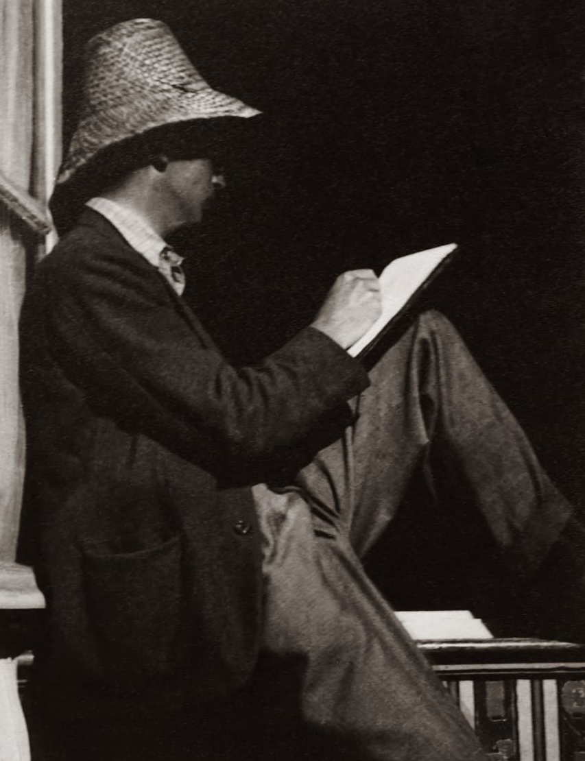 man sitting on handrails