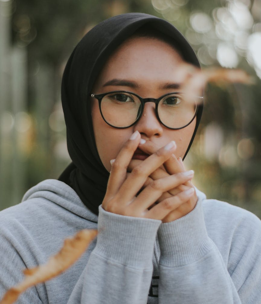 woman wearing eyeglasses and black hijab