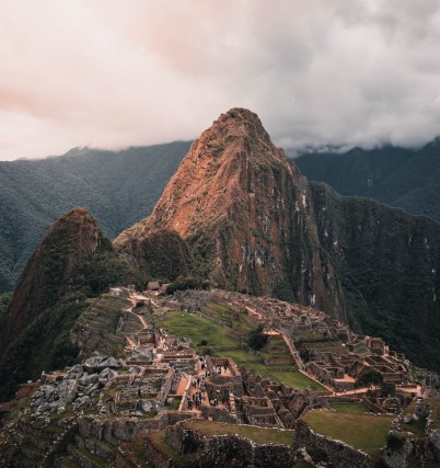 brown rocky mountain under white cloudy sky
