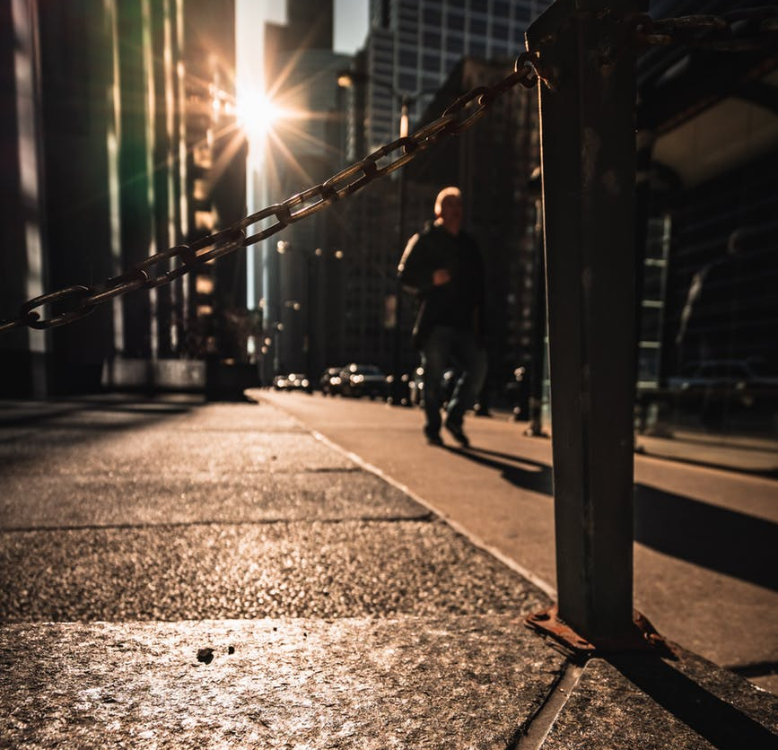 person standing on road