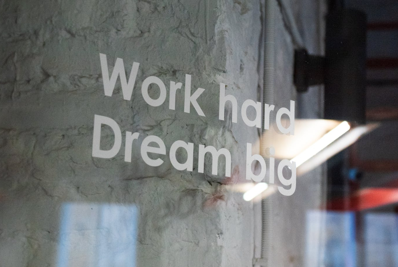 work hard dream big writing on glass case