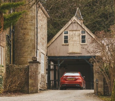 red car parked at garage