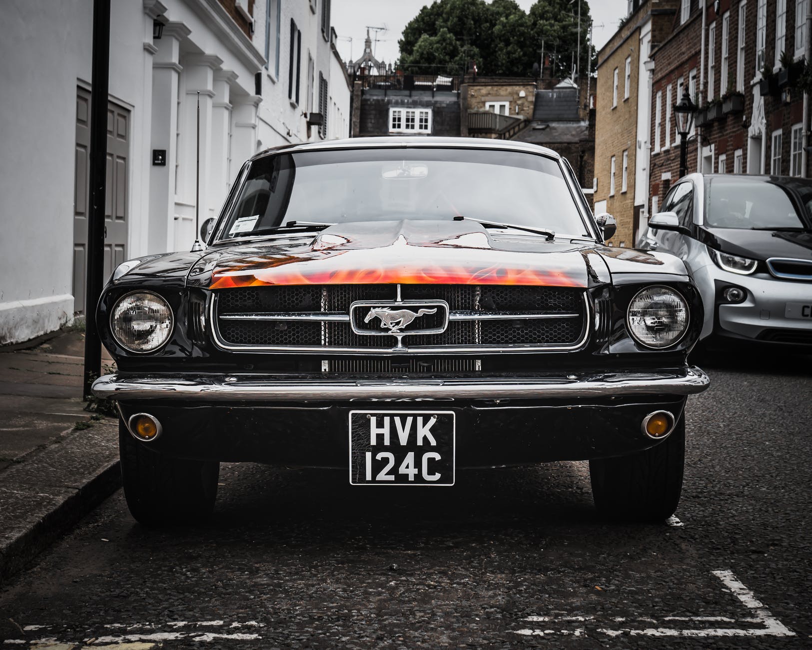 selective focus photography of black ford mustang car