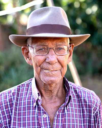 man wearing gray and brown hat with eyeglasses