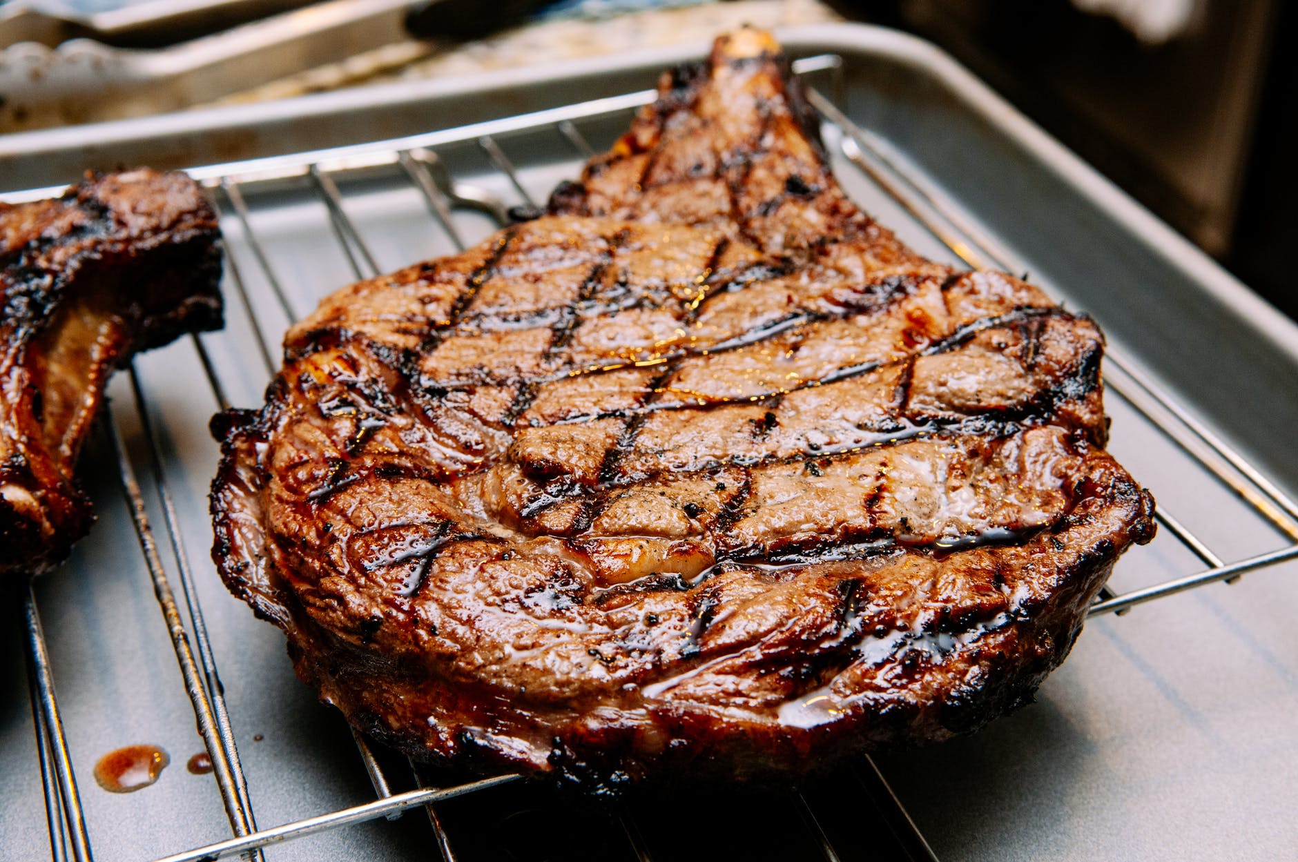 grilled meat on stainless steel tray