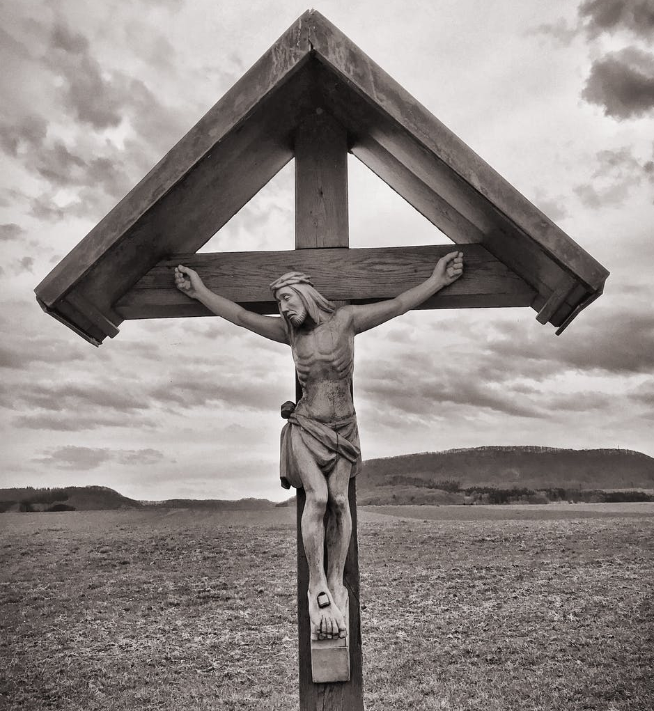 crucifix grayscale photo
