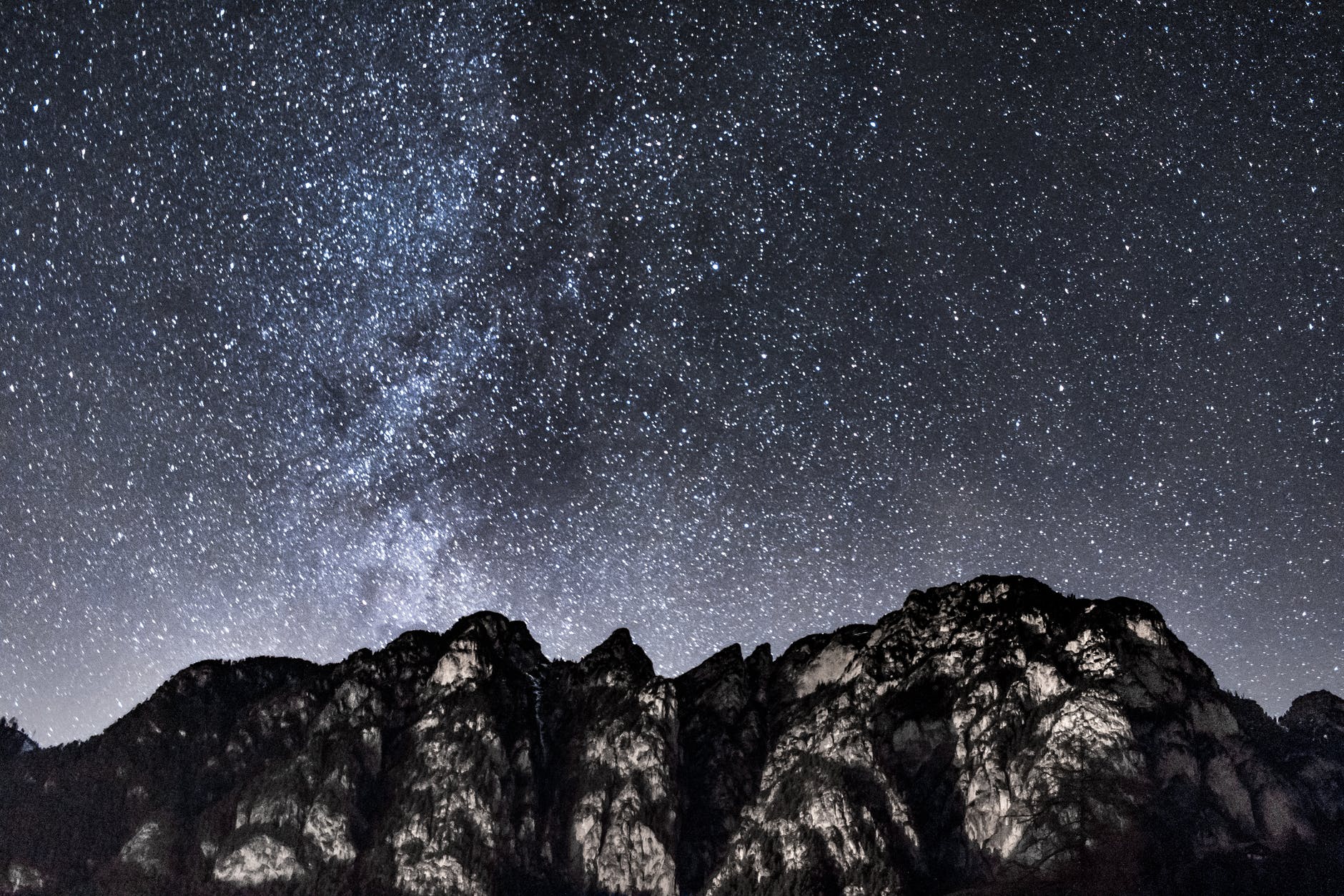 mountain under starry sky during nighttime