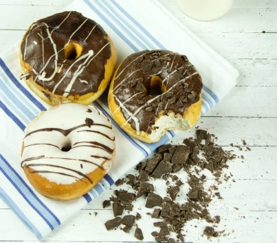 three assorted donuts with milk